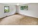 An empty bedroom with lots of natural light and wall-to-wall carpeting at 302 Melinda Ave, Kannapolis, NC 28083