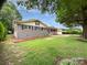 Single-story house with manicured lawn, walkway, and classic curb appeal at 302 Melinda Ave, Kannapolis, NC 28083
