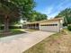 Classic home with attached garage, driveway, and mature landscaping at 302 Melinda Ave, Kannapolis, NC 28083