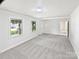 Spacious living room featuring neutral walls, plush carpet, and natural light at 302 Melinda Ave, Kannapolis, NC 28083