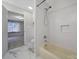 Bathroom with a shower/tub combo and white tile surround at 3800 Lovett Cir, Charlotte, NC 28210