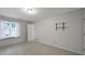 Spacious bedroom with natural light and a view of the front yard at 3800 Lovett Cir, Charlotte, NC 28210