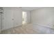Neutral bedroom with carpeted floors and a door leading to an adjacent bathroom at 3800 Lovett Cir, Charlotte, NC 28210