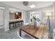 Charming dining area with stylish bar stools, decorative lighting, and a view to the dining area at 3800 Lovett Cir, Charlotte, NC 28210