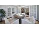An inviting dining room with French doors and decorative lighting fixtures enhance the space at 3800 Lovett Cir, Charlotte, NC 28210