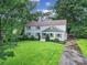 Charming two-story home with a well-manicured lawn and a long driveway at 3800 Lovett Cir, Charlotte, NC 28210