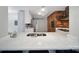 Modern kitchen featuring white countertops, stainless steel appliances, and exposed brick details at 3800 Lovett Cir, Charlotte, NC 28210