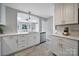 Spacious kitchen features white countertops, stainless steel appliances, and modern design elements at 3800 Lovett Cir, Charlotte, NC 28210