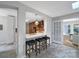 Kitchen features breakfast bar, stainless appliances, decorative lighting, and view of the dining area at 3800 Lovett Cir, Charlotte, NC 28210