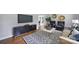 Bright and airy living room with modern furniture, decor, and hardwood floors at 3800 Lovett Cir, Charlotte, NC 28210