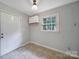 A versatile room with a neutral palette, closet space, and a large window at 3800 Lovett Cir, Charlotte, NC 28210