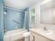 Bathroom features a tiled shower, sink, and commode at 409 Edgewood Ct, Lancaster, SC 29720