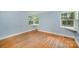 Bedroom features hardwood floors and corner windows at 409 Edgewood Ct, Lancaster, SC 29720