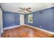Spacious bedroom with hardwood floors, ceiling fan, and natural light at 409 Edgewood Ct, Lancaster, SC 29720