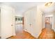 Hallway featuring hardwood floors, neutral paint and views into adjoining rooms at 409 Edgewood Ct, Lancaster, SC 29720