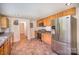 Kitchen features stainless steel appliances, wood cabinets, tile flooring, and recessed lighting at 409 Edgewood Ct, Lancaster, SC 29720