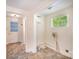 Laundry room with tile floors, a utility sink, and a window for natural light at 409 Edgewood Ct, Lancaster, SC 29720