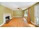 Bright living room with hardwood floors, a fireplace and large windows at 409 Edgewood Ct, Lancaster, SC 29720