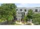 Beautiful townhome with three stories, modern design, professional landscaping and lovely curb appeal at 5006 Tiny Ln, Charlotte, NC 28203