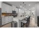 Bright, modern kitchen featuring a large center island with bar seating and pendant lighting at 5006 Tiny Ln, Charlotte, NC 28203
