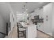 Modern kitchen with a large island, barstool seating, and stainless steel appliances at 5006 Tiny Ln, Charlotte, NC 28203