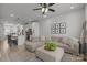 Open-concept living area with a comfortable sectional sofa and seamless flow to the kitchen at 5006 Tiny Ln, Charlotte, NC 28203