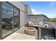 Stylish rooftop patio featuring a modern fire pit, comfortable seating, and a sleek outdoor design at 5006 Tiny Ln, Charlotte, NC 28203