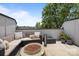 Charming outdoor patio with comfortable seating, a fire pit, and beautiful city views at 5006 Tiny Ln, Charlotte, NC 28203