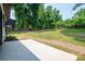Spacious backyard featuring a concrete patio and partially-fenced yard at 520 E Main St, Dallas, NC 28034
