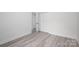 Bright bedroom with luxury vinyl flooring and a closet that is conveniently accessible at 520 E Main St, Dallas, NC 28034