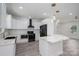Gorgeous kitchen with white cabinets, quartz countertops, stainless appliances, and stylish pendant lighting at 520 E Main St, Dallas, NC 28034