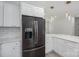 Modern stainless steel refrigerator and white subway tile highlight this sleek, modern kitchen at 520 E Main St, Dallas, NC 28034