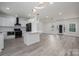 Open concept living space with great flow from kitchen to living areas, and modern lighting at 520 E Main St, Dallas, NC 28034