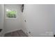 Neutral-colored room with luxury vinyl flooring and a single window bringing in natural light at 520 E Main St, Dallas, NC 28034