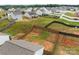 Aerial view of backyard with wooden privacy fence and large cleared grassy space at 5314 Upton Pl, Charlotte, NC 28215