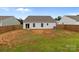 Home's backyard is enclosed by a wooden fence for privacy at 5314 Upton Pl, Charlotte, NC 28215