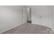 Neutral bedroom with carpeted floors and a closet at 5314 Upton Pl, Charlotte, NC 28215