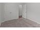 Neutral bedroom with carpeted floors and white doors at 5314 Upton Pl, Charlotte, NC 28215
