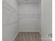 Walk-in closet featuring wire shelving to maximize storage and organization at 5314 Upton Pl, Charlotte, NC 28215