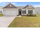 Lovely home with a two-car garage, stone-lined flower beds, and well-maintained lawn at 5314 Upton Pl, Charlotte, NC 28215
