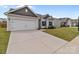 Charming home exterior featuring a two-car garage, great lawn and landscaping at 5314 Upton Pl, Charlotte, NC 28215