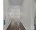 Welcoming foyer with hardwood floors leading to a bright living space with ample natural light at 5314 Upton Pl, Charlotte, NC 28215