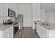 Well-appointed kitchen featuring stainless steel appliances, granite countertops, and ample cabinet space at 5314 Upton Pl, Charlotte, NC 28215