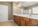 Bathroom featuring double sinks, modern lighting, and a separate glass-enclosed shower at 56119 Finches Ct, Indian Land, SC 29707