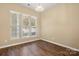 This bedroom is bright with hardwood floors and natural light from the many windows at 56119 Finches Ct, Indian Land, SC 29707
