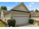 Home's garage and driveway with landscaping at 56119 Finches Ct, Indian Land, SC 29707