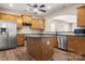 A modern kitchen island features wood cabinets, sleek countertops, and stainless steel appliances at 56119 Finches Ct, Indian Land, SC 29707