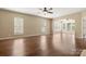 Spacious living room with gleaming hardwood floors, neutral walls, and abundant natural light at 56119 Finches Ct, Indian Land, SC 29707