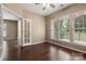 Home office featuring hardwood floors, natural light, and a French door leading to another room at 56119 Finches Ct, Indian Land, SC 29707
