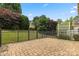 A large, flat brick patio with a metal fence perfect for outdoor gatherings and relaxation at 56119 Finches Ct, Indian Land, SC 29707